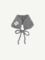 Detailed view of the grey fuzzy knit neck warmer with cute ties and woven label tag. - One Size / Gray