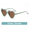Green heart-shaped children sunglasses with floral applique and brown lenses for stylish kids. - Vintage Green