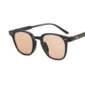 Trendy black frame sunglasses with blush tinted lenses for women, stylish street fashion eyewear. - Bright Black Frame Tea Lens