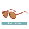 Cute kids sunglasses with colorful rainbow accent, pink frame and brown lenses for stylish daily wear. - Sand Orange