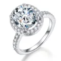 Eleganter Ring mit ovalem Moissanit und Zirkonias in Silberoptik für Verlobung und Hochzeit. - HK 15 / US 7 / Weißgold Weißer Moissanit [1 Karat]