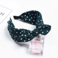 Close-up detail shot of dark green polka dot bow headband, cute rabbit ear style hair hoop. - Green Polka Dot Rabbit Ears / Green