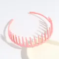 Pink plastic tooth hair headband, non-slip daily hair hoop accessory for women detail view. - Pink