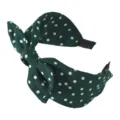 Dettaglio di cerchietto a pois verde scuro, elegante accessorio per capelli fiocco. - Verde