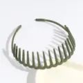 Close-up detail of dark green plastic tooth headband, non-slip hair hoop accessory for daily styling. - Green