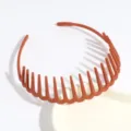 Detail shot of brown plastic multi-tooth hairband, anti-slip design for everyday wear. - Orange Red