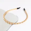 Detail shot of chic crystal pearl thin metal headband, elegant hair accessory for daily wear. - Champagne
