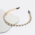 Detail shot of Korean style thin crystal pearl headband, gold chain design with blue rhinestones. - Navy Blue