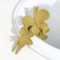 Matte mustard yellow double butterfly hair claw clip detailed closeup view for daily styling. - Matte Yellow