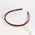 Matte plastic thin hair hoop with teeth in solid color, stylish non-slip hair accessory for daily wear. - Regular Fit / Light Red