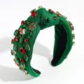 Closeup detail of green fabric knotted Christmas rhinestone crystal hair hoop headband. - Green
