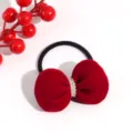 Closeup of red velvet bow hair tie with pearl center knot on a clean white background. - Pearl Padded Bow Hair Tie / 1 Piece/Pack / Red
