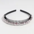 Close-up of a black hair hoop with teeth, decorated with gleaming pearls and sparkling rhinestones. - Pink