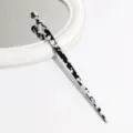 Black and white acetate hair stick detail, elegant leopard pattern hair accessory for elegant buns. - Black and White