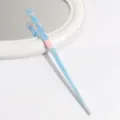 Close-up view of a blue and pink swirled acetate hairpin showcasing its elegant texture. - Blue Pink