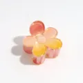 Detail view of the gradient flower hair claw clip, featuring translucent pink and yellow petals. - 4cm Flower Orange Yellow