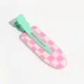 Detail shot of the cute pink and green checkered duckbill hair clip, showing the glossy texture and metal clasp. - Striped Checkered Pink Green