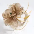 Close up shot of elegant champagne feather fascinator mesh flower hair hoop detail view - Champagne Veil Feather