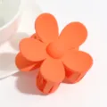 Matte orange flower hair claw clip close up view, lovely hair accessories for daily styling. - Orange