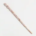 Detailed view of a stylish acetate hair stick with a chic twisted design and marbled pattern. - Nude Marble Pattern