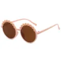 Occhiali da sole rotondi per bambini con graziosi fiori di margherita e montatura rosa. - Rosa