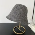 Detailed view of the stylish gray mesh knit bucket hat showing the delicate hollow pattern. - M (56-58cm) / Gray