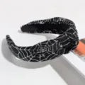 Halloween black knotted headband with shiny silver spider web pattern detail close-up - Spider Web Black