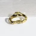 Gold metal hair claw clip detail view, irregular geometric cloud design, shiny hair accessory. - Cloud Hair Claw / Cloud Gold
