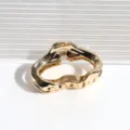 Gold metal cloud hair claw clip detail shot, elegant minimalist design for daily hairstyles. - Cloud Hair Claw / Cloud Orange Gold