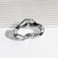Close-up detail of the minimalist silver metallic cloud hair claw clip, showing glossy texture. - Cloud Hair Claw / Cloud Silver