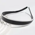 Close-up view of the black and white colorblock headband, glossy finish hair accessory. - Black and White