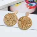 Bohemian round woven rattan earrings with gold metal top studs for stylish daily wear. - Gold Disc Straw Woven Drop Earrings