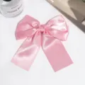Pink satin bow hair clip with long ribbon tails, elegant sweet hair accessory for women. - Light Pink
