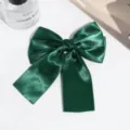 Dark green satin bow hair clip detail, elegant fabric ribbon and secure duckbill clip design. - Dark Green