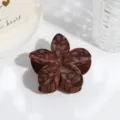 Close-up of a brown flocked flower hair claw clip with a stylish leopard pattern design. - Lily Leopard Pattern / Brown Frangipani