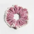 Pink velvet hair scrunchie detailed with elegant faux pearls, perfect winter hair accessory. - Rose Red