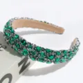 Detailed view of a luxury Baroque green rhinestone headband, elegant banquet hair accessory. - Green