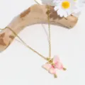 Close-up detail view of the elegant pink butterfly pendant necklace displayed on driftwood. - Pink Double Layer Butterfly