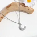 Elegant silver crescent moon necklace with sparkling rhinestones and star charm for women. - Silver Moon