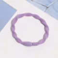 Purple braided hair tie close-up detail, elastic hair band accessory for daily wear and styling. - Spiral Purple