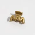 Detailed close-up view of a stylish gold wavy hair claw clip designed for daily styles. - Wave Style / S / Gold