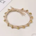Beige braided hair tie with gold rhinestone metal beads, elastic fashion hair accessory. - Braided Rhinestone