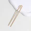 Close-up detail of a minimalist gold U-shaped hair fork with delicate engraved pattern. - Thin U-Shaped (6129792203156)