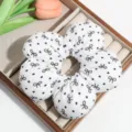 Sweet white floral hair scrunchie with cute black bows and polka dots for women daily wear. - White Bow