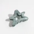 Detailed shot of grey green star hair claw clip with silver splatter design for daily styling. - Star / Grey Green