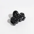 Detailed close-up of a black glitter wave hair claw clip, stylish hair accessory for women. - Wave / Black