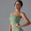 Close-up detail of a breathable green pleated tube top sports bra for yoga and fitness - S / Tops / Basil Green