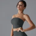 Close-up of ruched side detail on dark grey breathable yoga bandeau top - S / Tops / Badge Blue