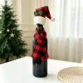 Close-up of creative Christmas mini hat and scarf decoration set on a wine bottle - Plaid Pointed Hat + Plaid Scarf Set