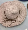 Woven wide-brim straw sun hat in pinkish beige with decorative brown bow detail for beach - Hand-woven with Bow Tie / Pink